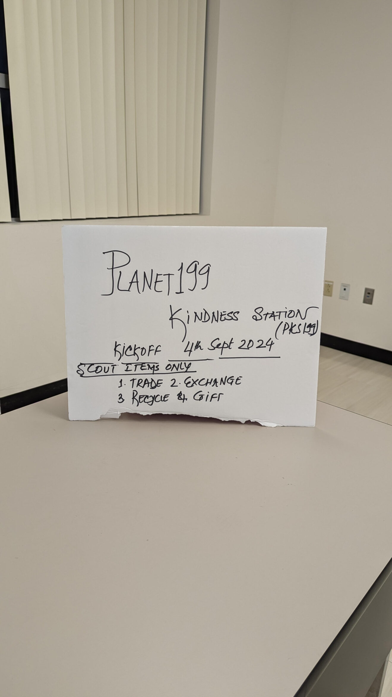 Troop 199 puts together a Planet Kindness Station to trade items with others